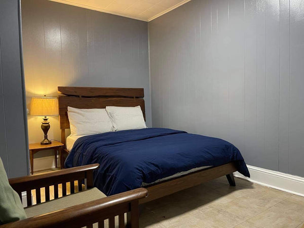 This is a private room with a full-size bed with a side table, dressing table, a New York, NY Home in Bronx · ★4.89 · 1 bedroom · 1 bed · 1 shared bath Private room in home vacation rental 48740096