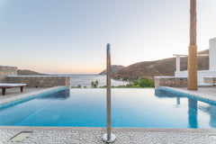 A unique luxury seafront villa with a private swimming pool. This fresh property Greece Premium pool villa Cycladic home vacation rental 36416400