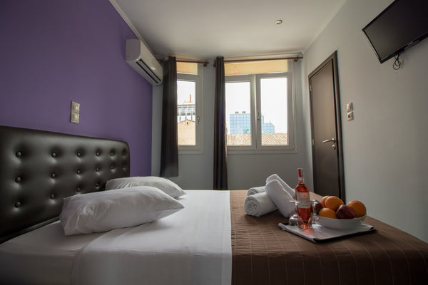 Room is fitted with dark leather double bed and wooden flooring. A crib can be a US Double Room | Cosmopolit Hotel Room in hotel vacation rental 53485701