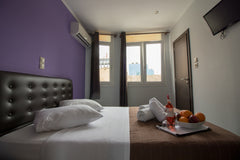 Room is fitted with dark leather double bed and wooden flooring. A crib can be a US Double Room | Cosmopolit Hotel Room in hotel vacation rental 53485701