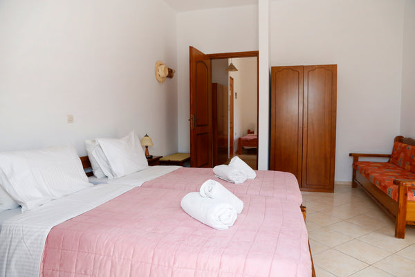 The two-room family room with 2 bedrooms has 2 single beds in each room and in o Rethimnon, Greece ATHINA ROOMS - 2 BEDROOM FAMILY APARTMENT Private room in condo vacation rental 27422317