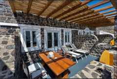 A shaded furnished terrace built with volcanic stone welcomes you upon entering  Greece Abrazo Villas "Villa Votsalo" Entire cottage vacation rental 15171139