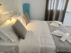 Executive queen apartment with one queen sized bed and a double coach - bed, pri Perissa, Greece Triple Apartment Entire serviced apartment vacation rental 44143022