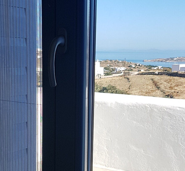 In the hills only 5 minutes away from the main town and terrific beaches, quiet  Athens, Greece Meli's Retreat 85m2, Cosy with sea & sunset view. Cycladic home vacation rental 15212769