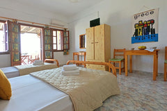 Spacious and bright apartment opening to a sunny balcony overlooking Perissa tow Perissa, Greece Family apartment with veranda • Almyra Entire rental unit vacation rental 6459760