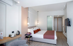 Comfortable & freshly decorated Junior Suite has a private balcony, mosquito net  Junior Suite by The City Hotel & Suites Room in hotel vacation rental 34353884