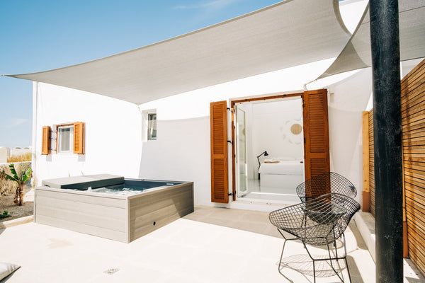 Featuring a bedroom with a queen size bed, a separate lounge area with a built-i  Mesanto Family Suite | Outdoor Hot Tub Entire rental unit vacation rental 39596067