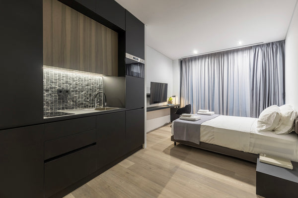 The suite has soft neutral palettes, a comfortable living room, a cozy bedroom a CY The Duke suite 201 (studio suite) Room in aparthotel vacation rental 38175360