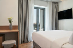NLH KERAMEIKOS - Neighborhood Lifestyle Hotels features a fitness center and a b Athens, Greece NLH Kerameikos | Deluxe Double Room Room in hotel vacation rental 52273163