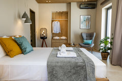 Step into your private haven, complete with a double bed and a balcony overlooki  Superior Suite I - Horizon Luxury Suites Sea Views Entire condo vacation rental 40968149
