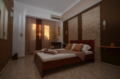 Room size 30 m²<br />located in Afantou, near the main road of 'Rodos - Lindos'. Afantou, Greece Triple Brown Room - Rhodes - Karmik Hotel Private room in bed and breakfast vacation rental 39220891
