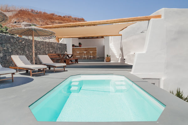 Lounge under a thatch parasol by the shared pool and soak up the blend of luxury Greece Karpimo Suites, Aspa House Entire condo vacation rental 20958881