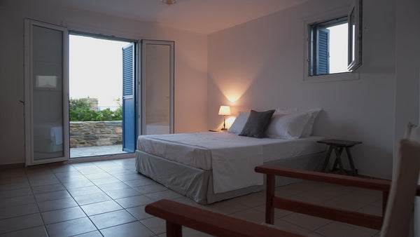 The house is built on the top of a cliff situated right above the port offering   Looking For the Sun Andros Vacation House I Cycladic home vacation rental 19631974
