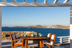 The Villa enjoys an uninterrupted view of the islands of Delos and Rhenea over a Gstaad, Switzerland Chic Villa Overlooking the Gleaming Sea Entire villa vacation rental 47837535