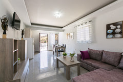 At the center of the famous resort , Panormos, and only 200 metres from the loca  Cozy apartment for 3 persons in Panormo, sea view Entire rental unit vacation rental 35860542