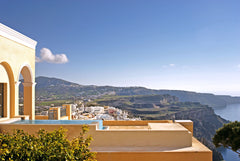 The dramatic volcanic landscape of Santorini, with its black cliffs towering fro  Villa Theras Entire villa vacation rental 648230359919140488