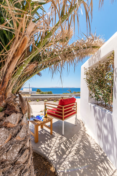 The spacious Delos Suite consists of 2 bedrooms, each with their own private bat Greece O Lofos DELOS Suite in Agios Stefanos w/seaview Room in boutique hotel vacation rental 13621763