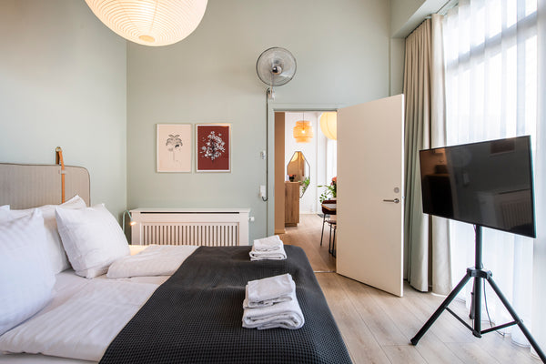 This bright and beautiful one bedroom apartment is bathed in daylight from floor Copenhagen, Denmark By The Beach Apartments- IntoThisPlace Room in serviced apartment vacation rental 26913728