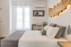 Open a bottle of wine at a private bistro table and enjoy peaceful views of the  Naousa, Greece Comfy Studio Next to the Beach with Sea & Sunset View Entire rental unit vacation rental 32738400