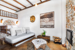 A spacious 30m2 traditional room decorated with natural stone and wood, which ca  Family Junior Suite Room in boutique hotel vacation rental 27632254
