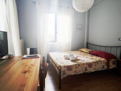 A simple room with a double bed, a desk, plenty of power outlets to charge your  Athens, Attica, Greece Cozy room in the Athens center (CARAVEL hotel) Private room in rental unit vacation rental 30302121