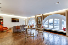 This one-bedroom apartment has a unique style. With arched windows, gleaming woo Paris, France Sweet Inn | Exclusive 1BR Apt. in front of the Louvre Entire rental unit vacation rental 10346411