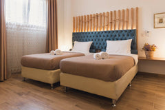Dome Luxury Rooms are located on the first floor of a renovated building in the   Dome Luxury Rooms | 4. Triple room Room in hotel vacation rental 31136042