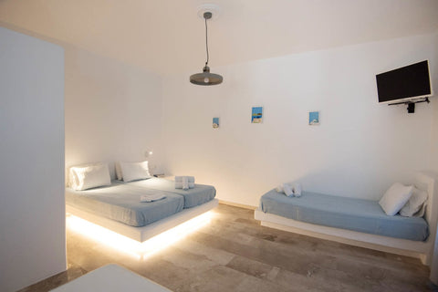 Just a breath away from the sandy beach (300m), a stylish and cozy property, is   Paros Bespoke Gem  -Triple Enchanting Suite Private room in bed and breakfast vacation rental 584605654070956450