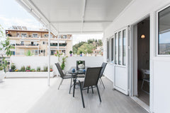 Set a table for two and have a leisurely lunch on a shaded terrace balcony with  Athens, Greece Sunny rooftop appartment luxury rennovated Entire rental unit vacation rental 35048837