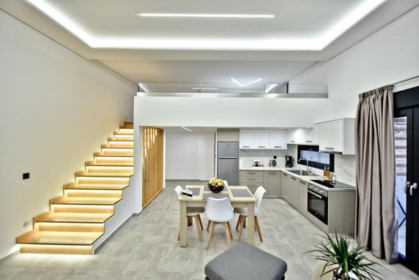 The combination of the discreet landscaping and the lighting design of the “Cret London, United Kingdom Tethys - Crete Southside Villas Entire home vacation rental 588102493334224219