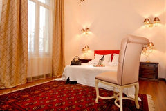 Features high ceiling, wooden floors, original paintings and beds with ecologica GR Triple Room Private room in bed and breakfast vacation rental 21208277