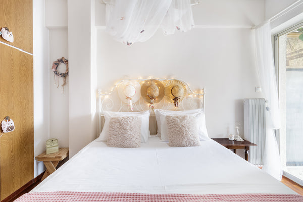 Drift off to sleep under the twinkling fairy lights in the calming, pastel-hued  Greece Dine on the Shaded Balcony in the Heart of the City Entire rental unit vacation rental 16297481
