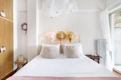 Drift off to sleep under the twinkling fairy lights in the calming, pastel-hued  Greece Dine on the Shaded Balcony in the Heart of the City Entire rental unit vacation rental 16297481