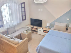 Take a break, feel like a local and relax in this beautiful cottage. Enjoy this  Milatos Beach, Greece Kertoshouse 🐬No4 Beautiful apartment with patio Private room in rental unit vacation rental 581064375426160344