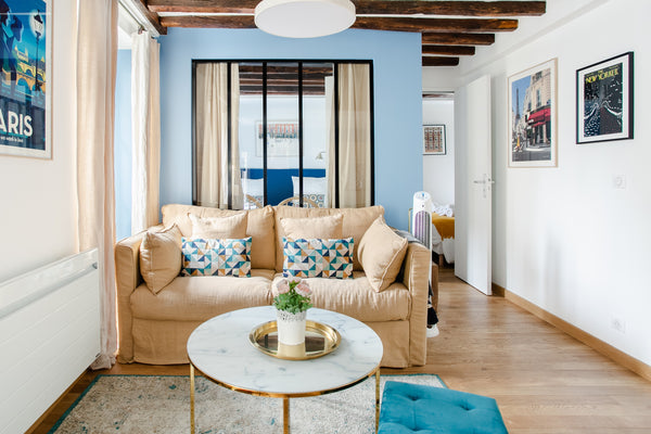 Sit in a tan leather butterfly chair beneath 17th-century wooden beams and look  Paris, France Peaceful Retro-Style Retreat in the Heart of the Marais Entire rental unit vacation rental 28505716