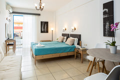 These ground-floor studios are open plan and have a balcony with views of the po  Rethymno ground floor studio @ Yacinthos Apts Private room in serviced apartment vacation rental 12046027
