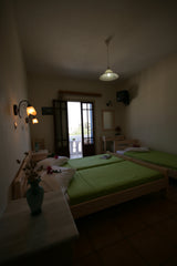 With paved courtyard with shady vines , the Cycladic- style Jasmine is located i  Twin room Private room in bed and breakfast vacation rental 9378244