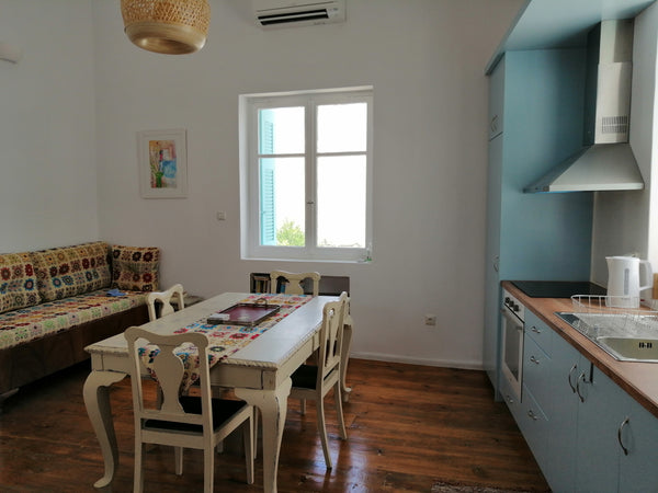 This newly renovated two-storey maisonette is part of an old traditional cycladi  