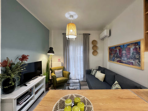 The unit us air conditioned and features a flat screen TV, a living room with a  Thessaloniki, Greece #White Rabbit by halu! Apartments Entire rental unit vacation rental 574990860611686423