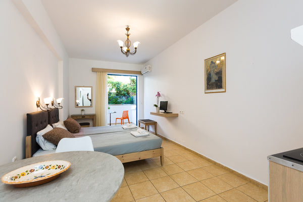 Yacinthos is situated right opposite the long sandy beach of Perivolia. It offer  Rethymno semi basement studios @ Yacinthos apts Private room in bed and breakfast vacation rental 50234592