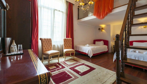 Features high ceiling, wooden floors, original paintings and beds with ecologica GR Family Room Private room in bed and breakfast vacation rental 21208314