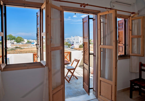 Spacious and bright apartment opening to a sunny balcony overlooking the Aegean  Perissa, Greece Bright apartment with nice view • Almyra Entire rental unit vacation rental 6403298