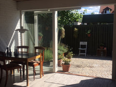 Enjoy your morning coffee or have an evening barbeque in the sunny courtyard of  Copenhagen, Denmark Hyggehouse with free street parking Entire home vacation rental 23225509