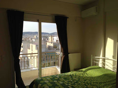 Each bedroom has a balcony, its own double bed, its own private wall-mount 40-in East Attica Regional Unit, Greece Luxury room Central Athens metro Private room in rental unit vacation rental 33224318