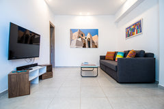 An apartment 50sqm with one bedroom with large wardrobe and double bed. The livi  Adelphi Cozy 2 The Budget Luxury Entire condo vacation rental 18317456