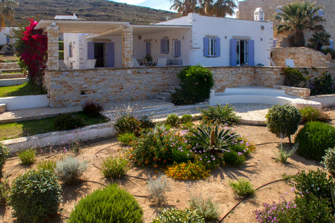 Villa Lithos sits on the hillside of Ampelas Bay, looking at the endless view of Greece Villa Lithos by Rocks Estates Cycladic home vacation rental 50047744