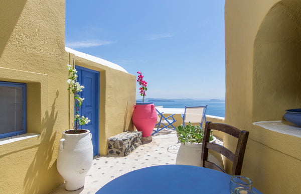 White stone, bright flowers, blue wood and yellow terracotta create a beautiful, Oia, Greece Annouso villa in Oia Entire villa vacation rental 2501359