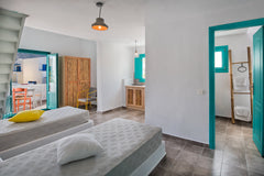 Maisonette: living room with two single beds, second bedroom in a loft with Quee Thira, Greece Split level apt for 2-4 guests close to the beach. Room in hotel vacation rental 3109519