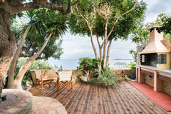 Take a nap in the shade of the towering trees, then fire up the outdoor oven for Agios Nikolaos, Greece Drink in Dreamy Ocean Vistas from the Picturesque Patio Room in aparthotel vacation rental 19034830