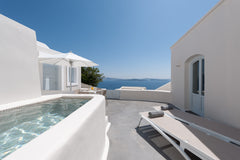 Live the dream in an elegant and modern, island villa with a veranda high above  Oia, Greece One bedroom villa with hot tub and Caldera view Entire villa vacation rental 11709079